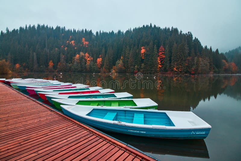 Boats on the Red Lake in Romania. Late autumn