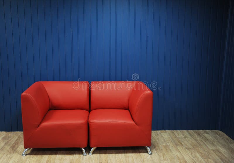 Red Leather Sofa on a Background of Blue Walls. Texture for the Design Stock Image Image of