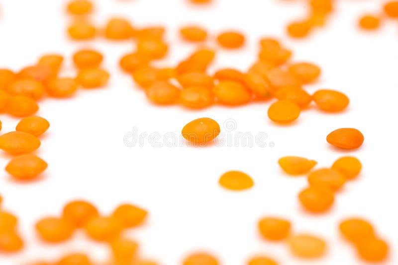 Red lentils on a white background