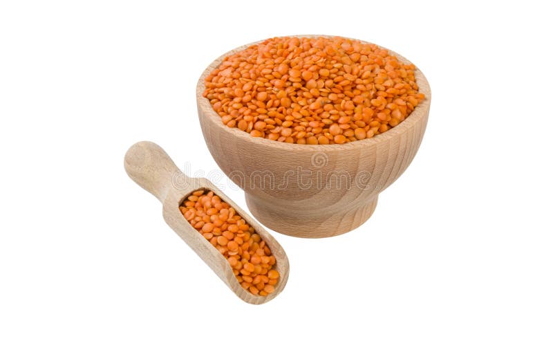 Red lentils in wooden bowl and scoop isolated on white background. nutrition. bio. natural food ingredient.