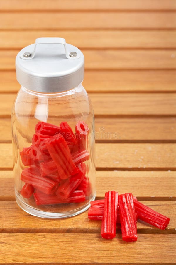 Red licorice on glass jar stock photo. Image of plenty 8019228