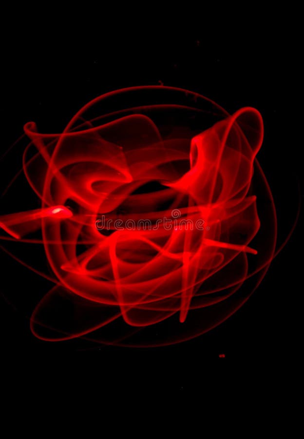 Red light painting, long exposure photography, ripples and round pattern stock image