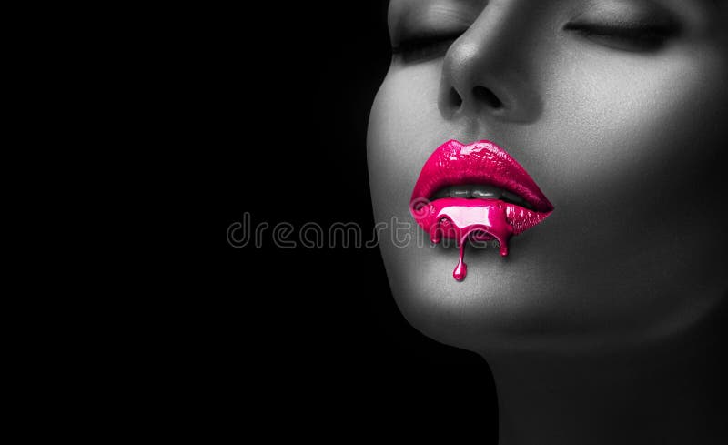 Red Lipstick dripping. Paint drips, lipgloss dripping from sexy lips, Blood liquid drops on beautiful model girl`s mouth