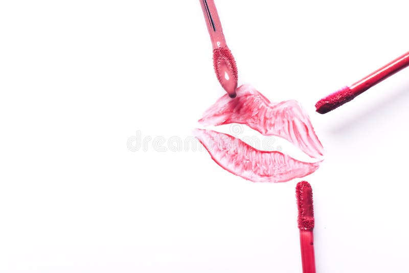 Red Lipstick Kiss with Lipstick Brushes on White Background Stock Image