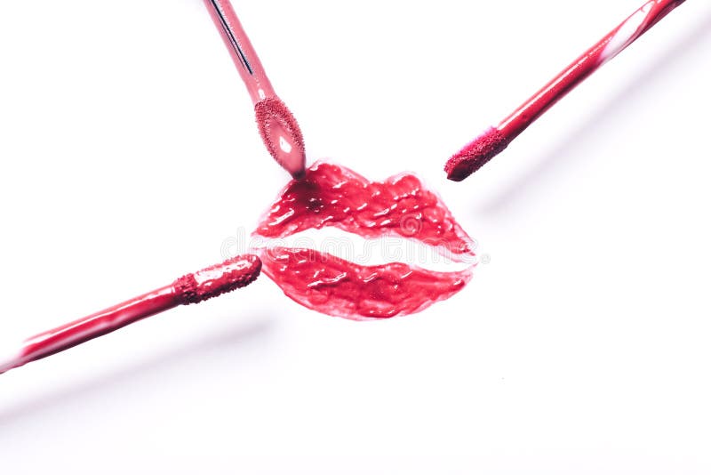 Red Lipstick Kiss with Lipstick Brushes on White Background Stock Image