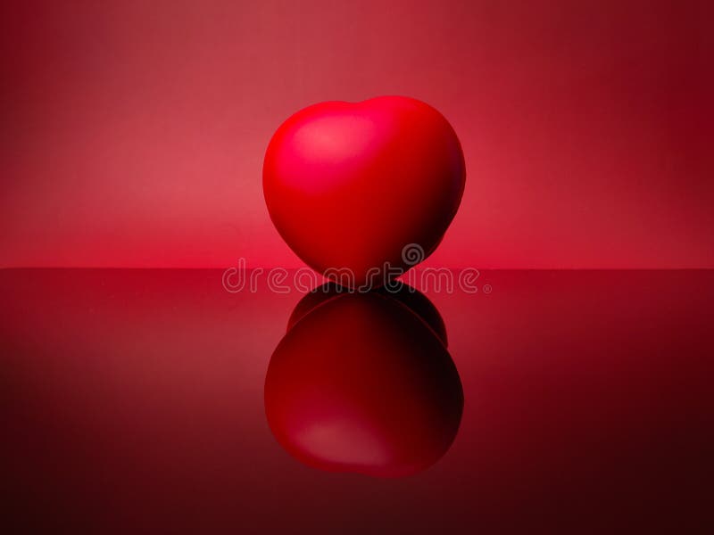 Red love with reflection on a red stock images