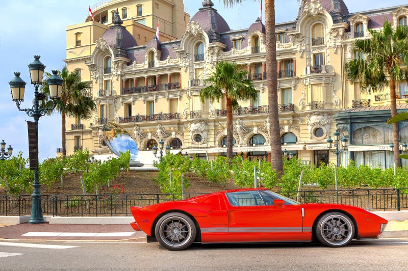 Red luxury car in front of Hotel de Paris at Monte Carlo, Monaco