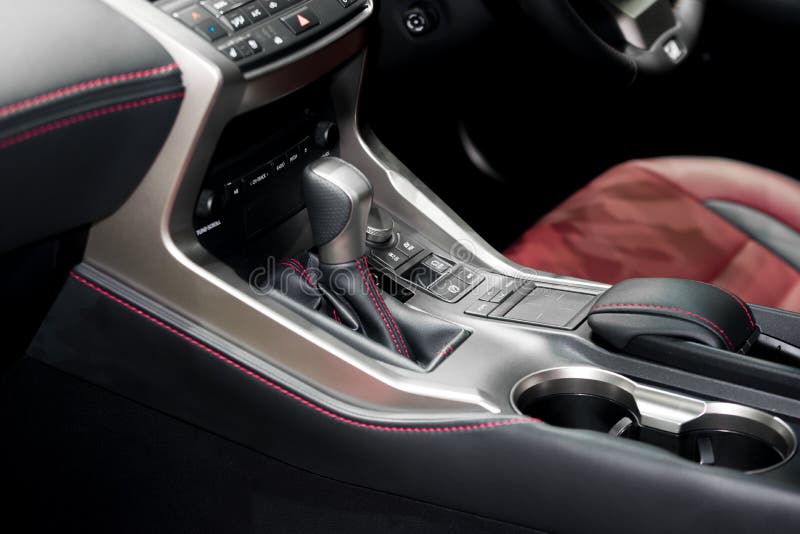 Red luxury car Interior with steering wheel, shift lever and air