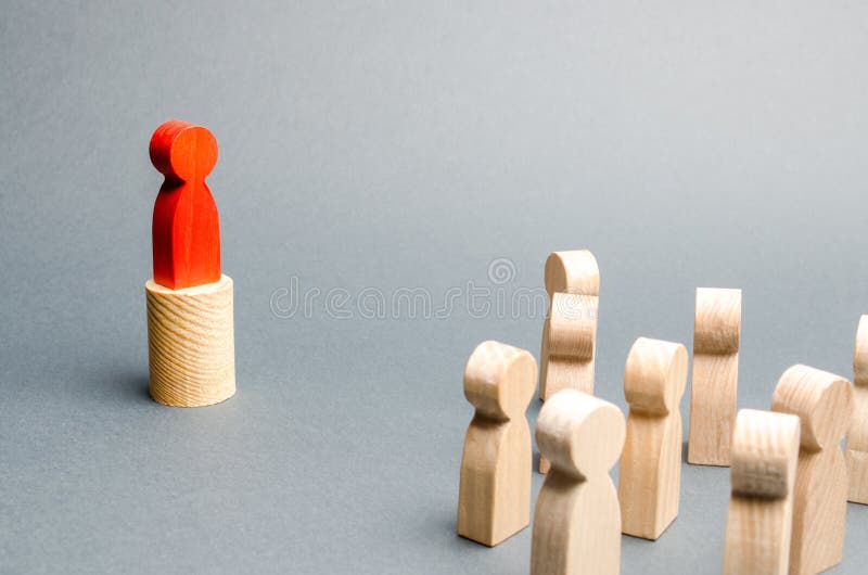 Red man stands on the podium and appeals to the crowd of people. Agitation, appeal and appeal to the crowd. Leader and leadership stock photo Red man stands on the podium and appeals to the crowd of people. Agitation, appeal and appeal to the crowd. Leader and leadership stock photo