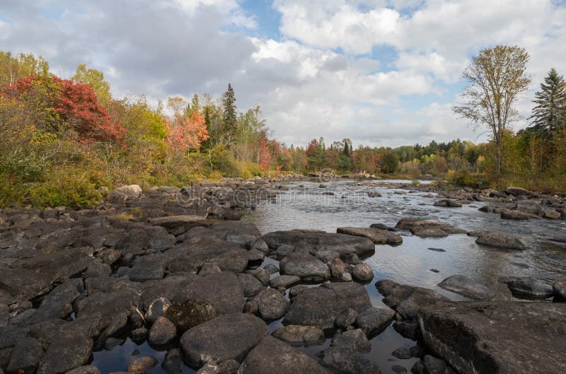 Autumn colors on the rocky Madawaska River in Canada