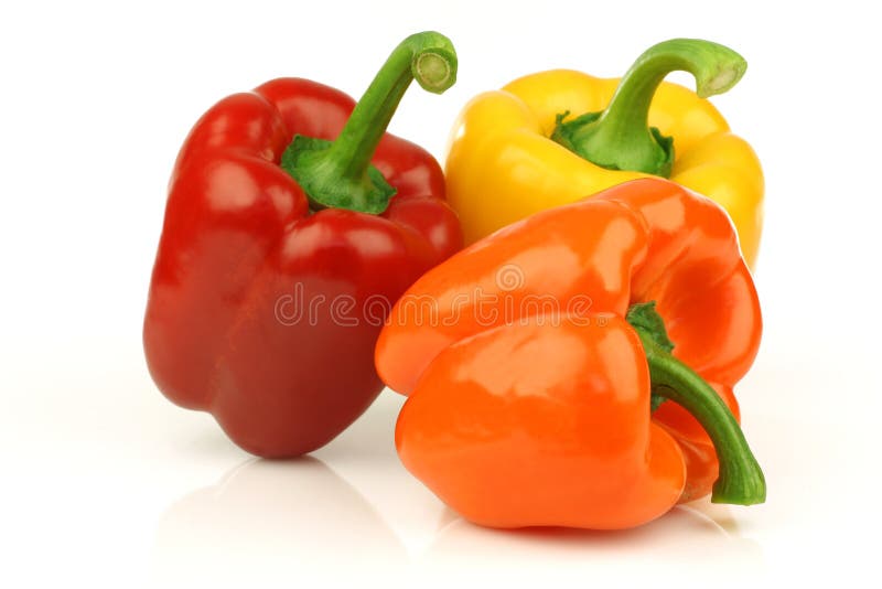 Red, orange and yellow paprika(capsicum) on a white background