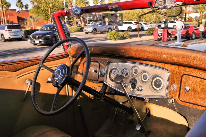 The red Packard coupe had seating for two in the front plus two in the rear rumble seat. Note the gauges that monitor the various engine functions. This was an upscale car in its day.
