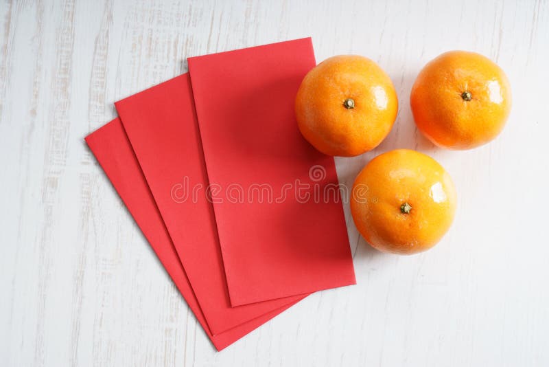 Red Packets with Mandarin Oranges Stock Photo - Image of pairs, wishes ...