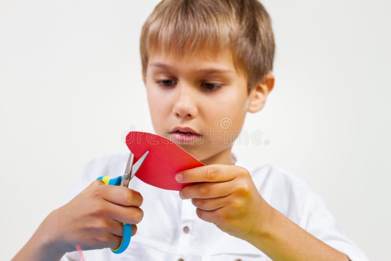 Children Cutting Colored Paper with Scissors at the Table Stock Photo -  Image of children, holding: 141799622