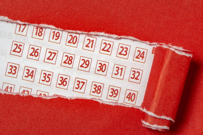 Red paper torn to reveal lottery ticket numbers