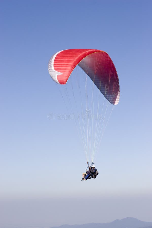 Red paraglider with two person