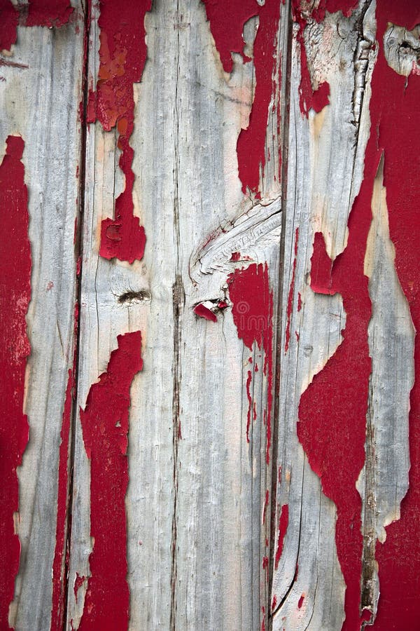 Red peeling painting on wall