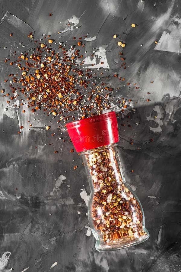 Red Pepper Mill with Spices and Salt on Gray Stock Photo Image of