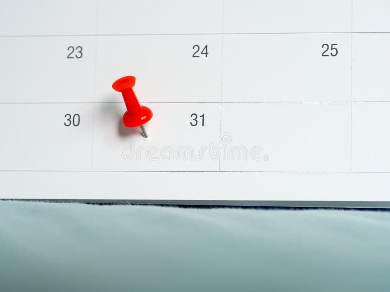 Red pin push on day 31 of end month on white calendar. Mark this day as salary date. Concept of meeting appointment reminder stock photo Red pin push on day 31 of end month on white calendar. Mark this day as salary date. Concept of meeting appointment reminder stock photo