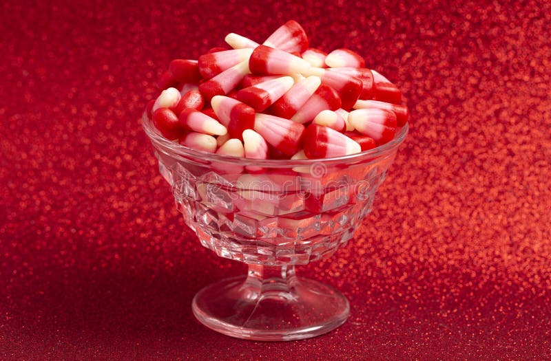 Red Pink and White Valentines Day Candy Corn on a Red Background Stock