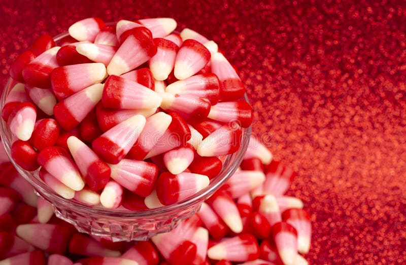 Red Pink and White Valentines Day Candy Corn on a Red Background Stock