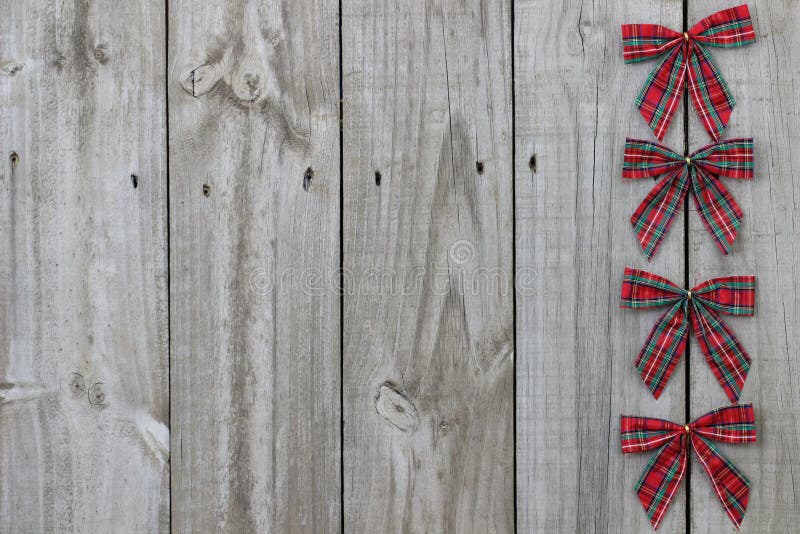 Red plaid bows border on wood sign