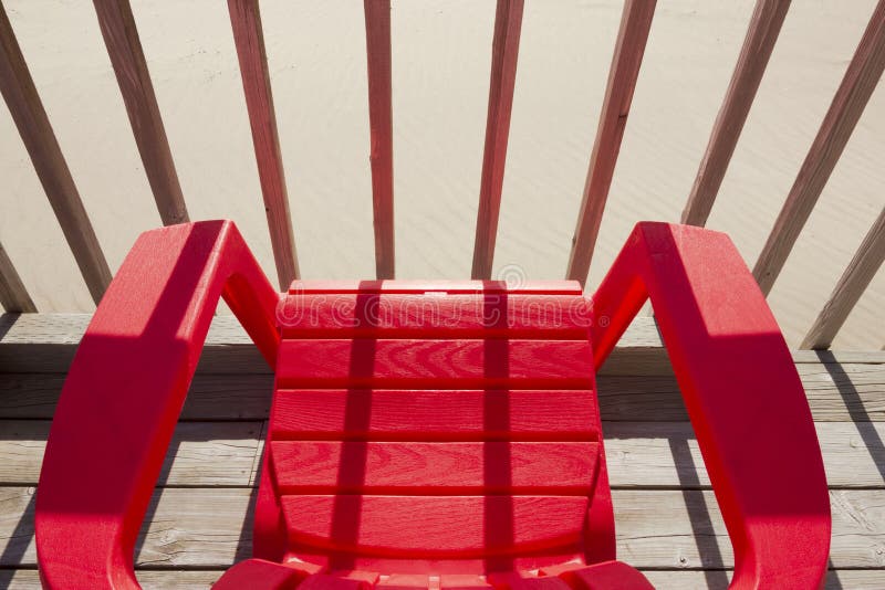 Red Plastic Beach Chair stock photo. Image of light 146949732