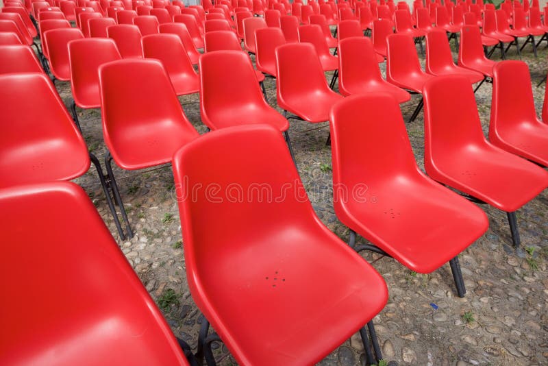 Red plastic chairs stock image. Image of seat, modern 185665937