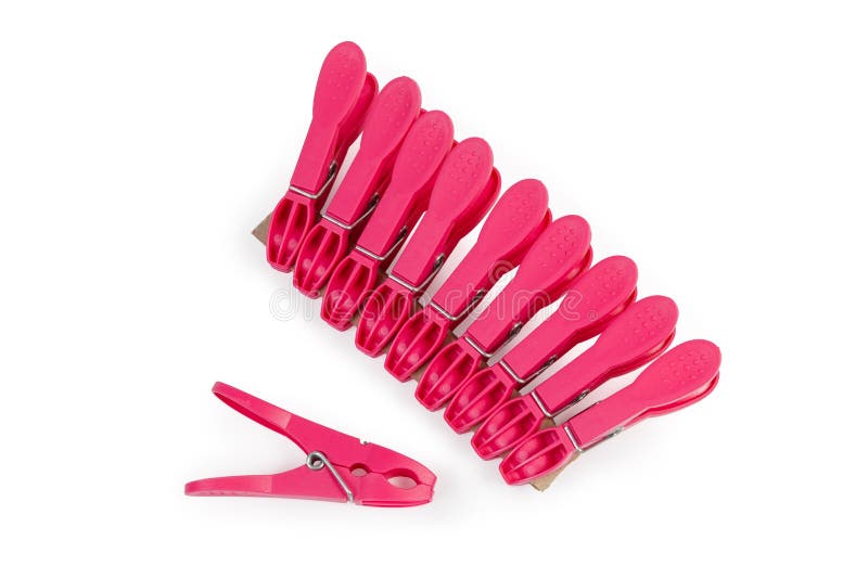 Red Plastic Clothespins on a White Background, Top View Stock Image