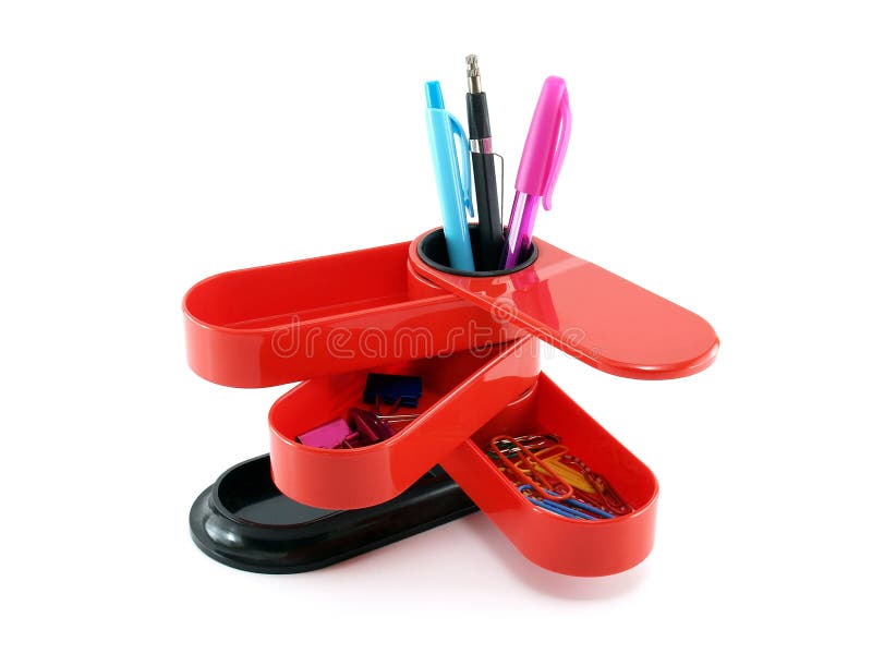 open red plastic desk organizer with colorful stationery isolated on white background