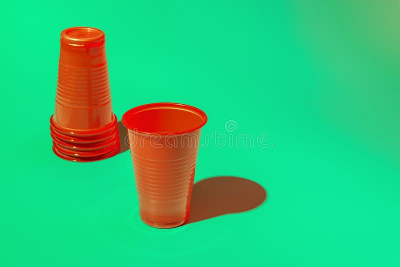 Red Plastic Disposable Cups on Mint Background,copy Space Stock Photo
