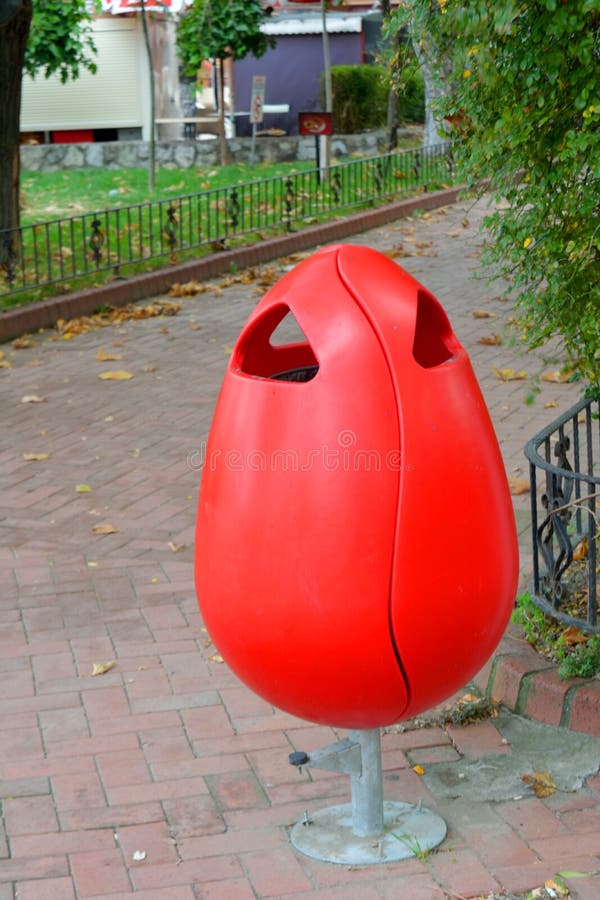 Red Plastic Garbage Can in the Park Stock Image Image of socialissues