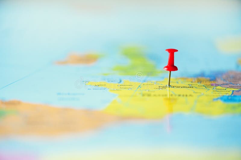 Red pushpin, thumbtack, pin showing the location, travel destination point on map. Copy space, lifestyle concept