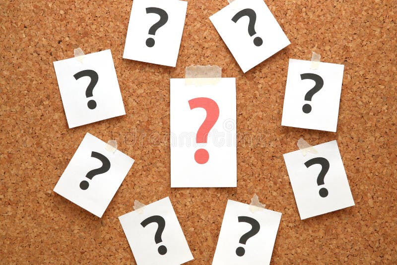 Red question mark on a piece of paper and many question marks on cork board. stock images Red question mark on a piece of paper and many question marks on cork board. stock images