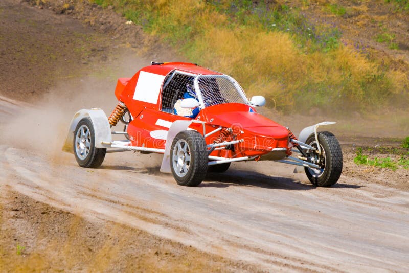 Red racing buggy on track royalty free stock images