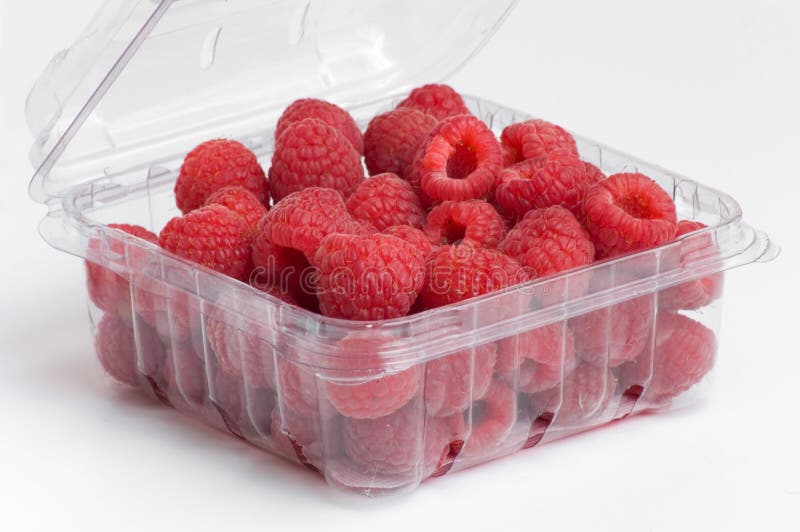 Red raspberries in plastic container