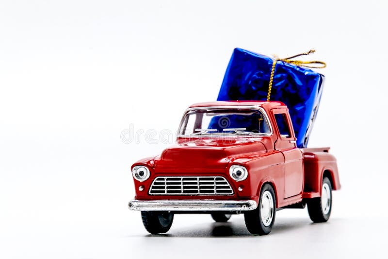 Red Retro Car Pickup with a Blue Gift Box Isolated Stock Photo Image
