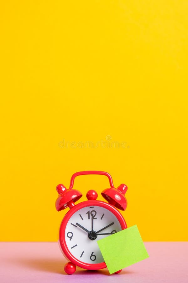 Red Retro Clock on Yellow Background. Green Sticker for Text Stock