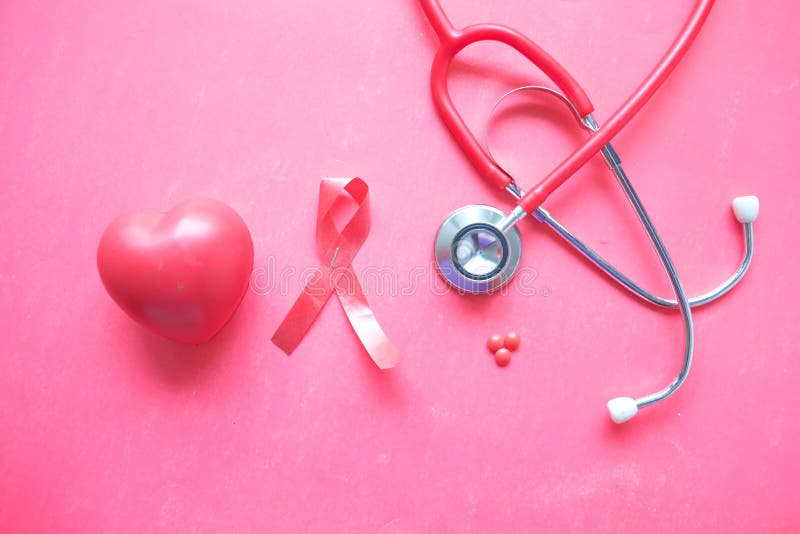 Red ribbon HIV, heart shape and stethoscope on red background. stock photos