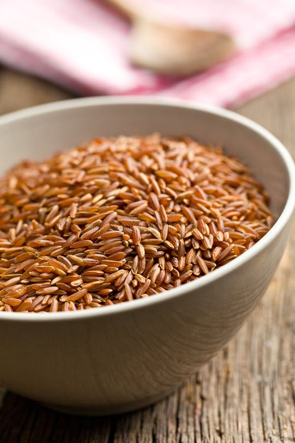 Red rice in ceramic bowl stock photo. Image of nutrition 35064734