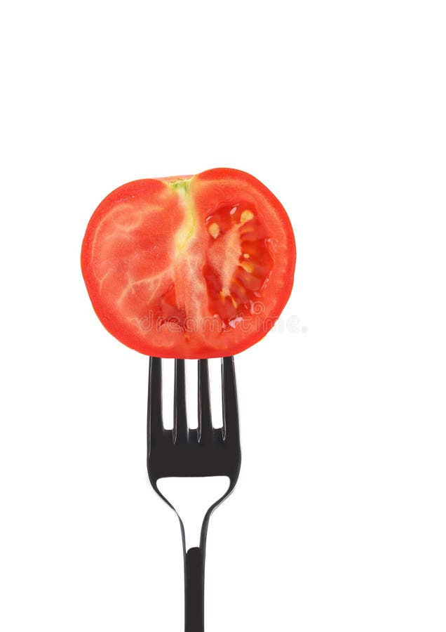 Red ripe tomato on fork.