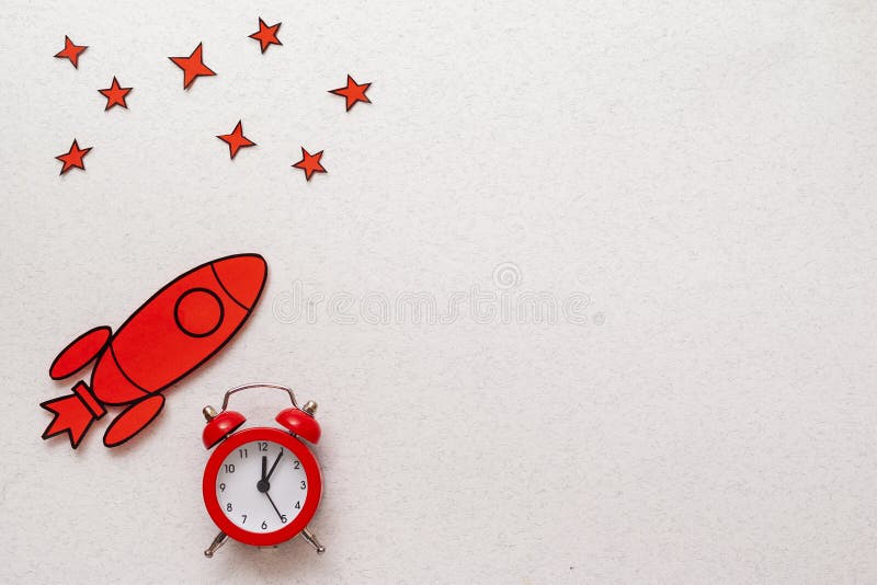 Red rocket border with alarm clock and stars stock photos