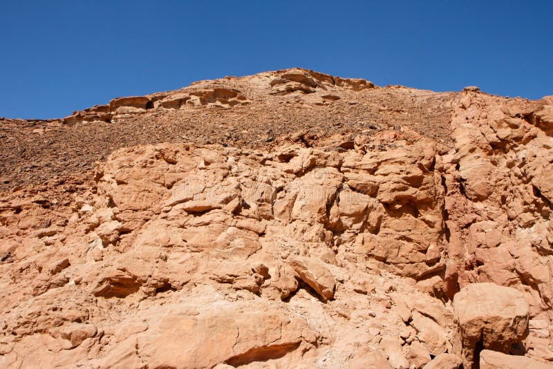 Red rocky hill in the desert landscape