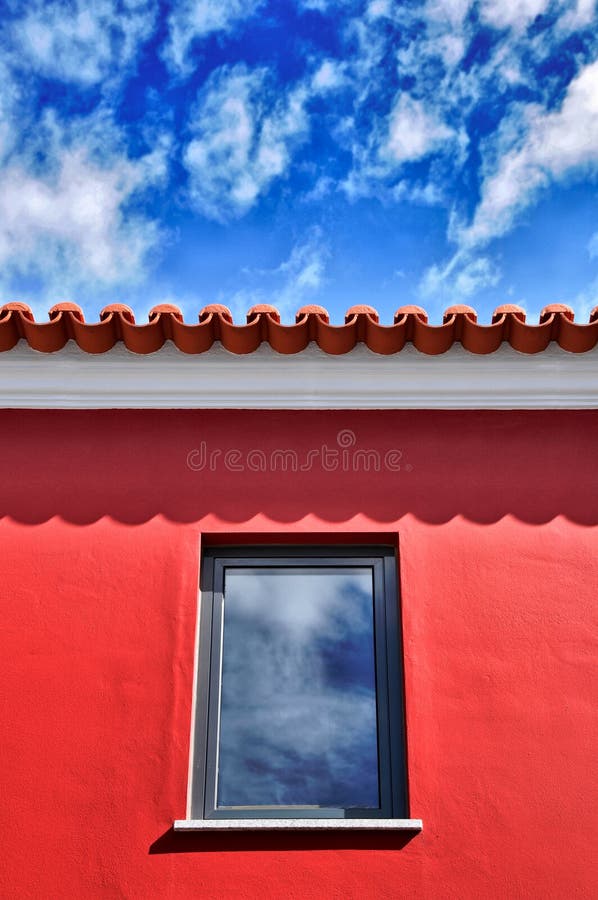 Red roof under blue sky