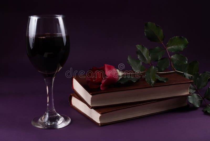 Elegant Elixir: Red Rose, Books, and Wine Glass