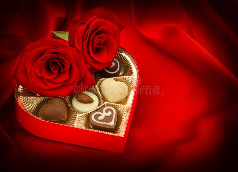 Red roses and chocolate candy. Gift box. Heart. Love