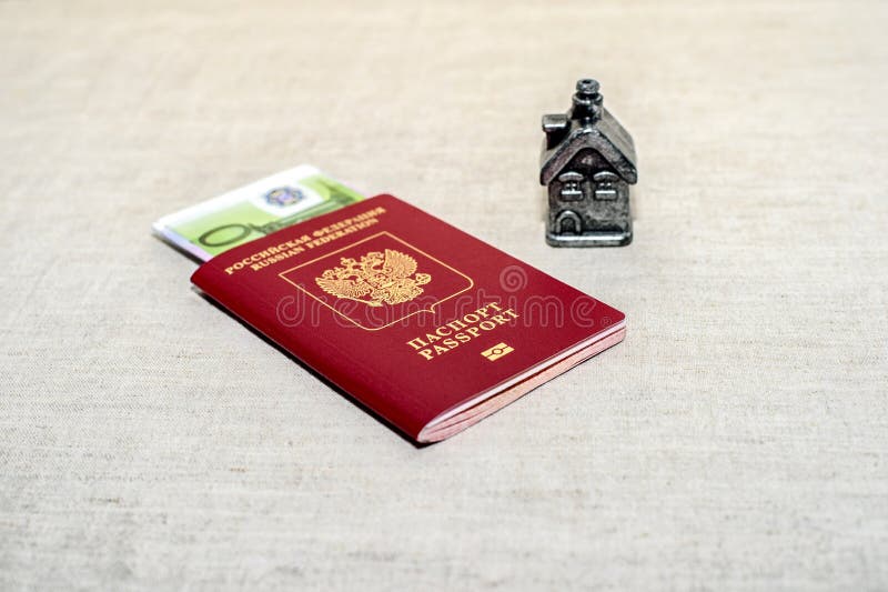 Red russian Passport, money and home - the concept of buying a property. royalty free stock photos Red russian Passport, money and home - the concept of buying a property. royalty free stock photos
