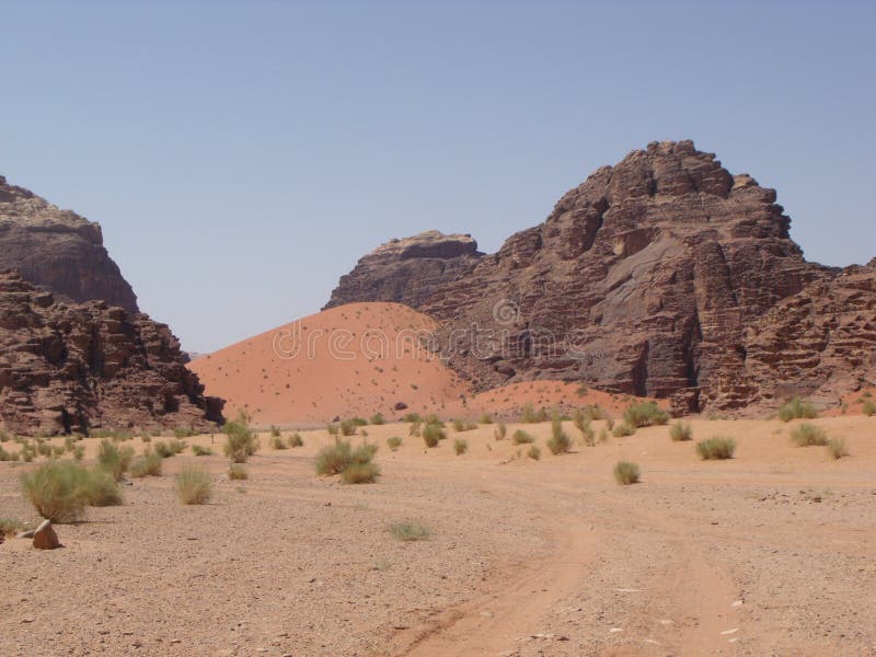 Red Sand Dunes among Mountains of Wadi Rum Desert, Jordan Stock Photo