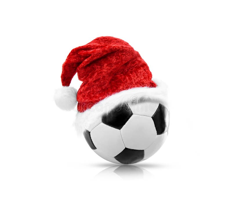 Red Santa Hat on a soccer ball isolated stock photos Red Santa Hat on a soccer ball isolated stock photos