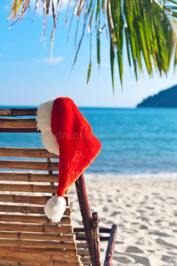 Red Santa s hat hanging on beach chair